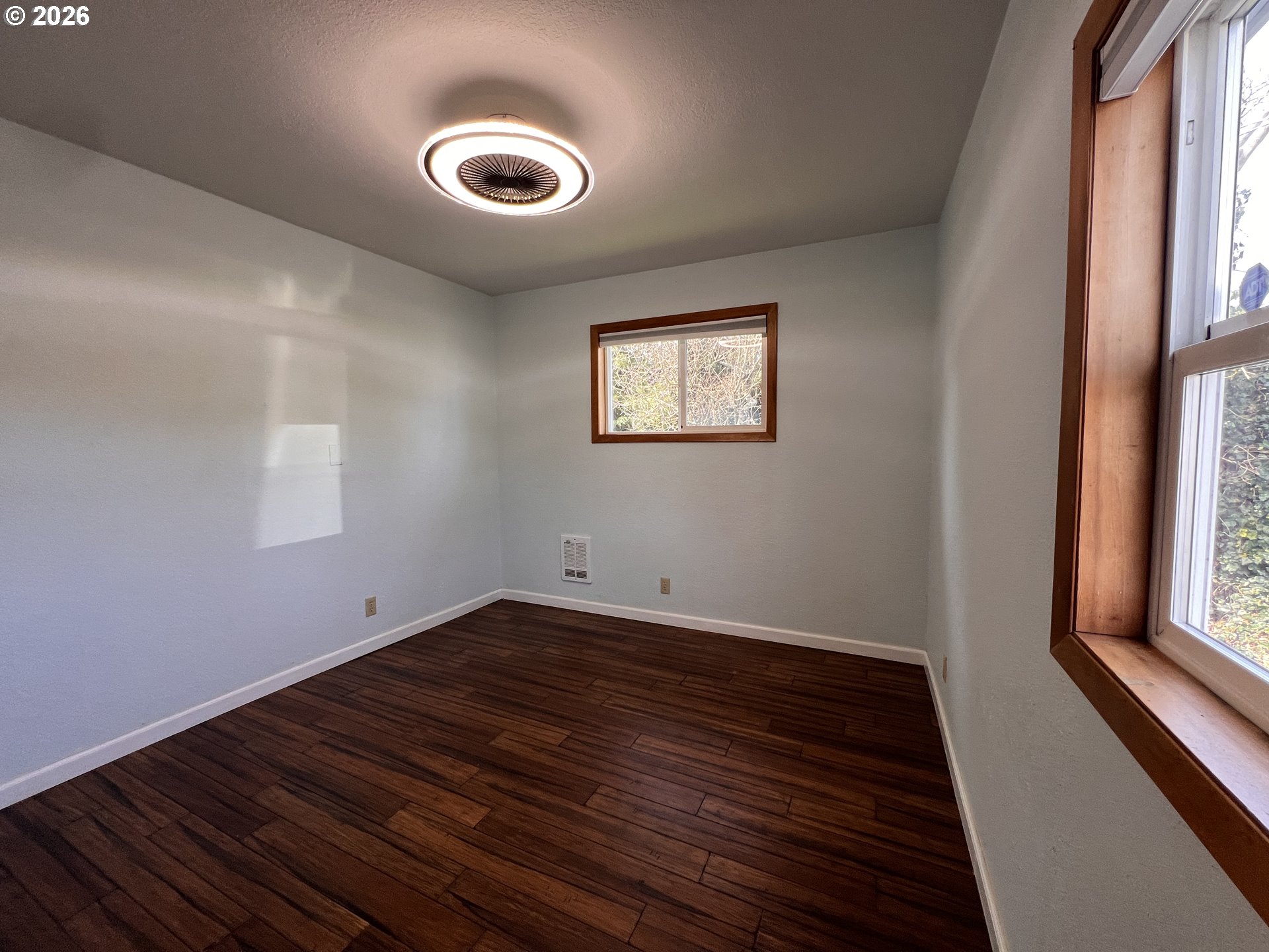 1092 Lewis Street North Bend, OR 97459 - Photo 20 of 43 a view of a hallway with wooden floor