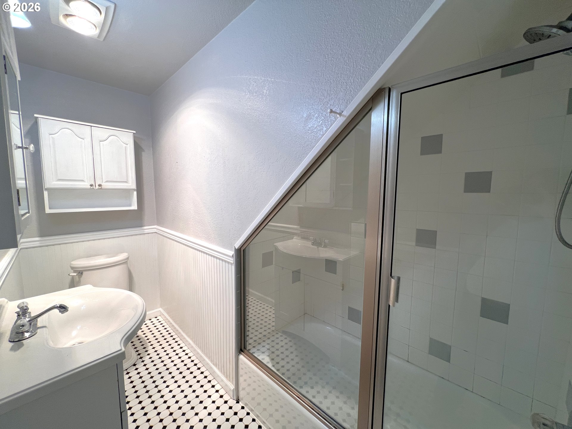 1092 Lewis Street North Bend, OR 97459 - Photo 22 of 43 a bathroom with a sink a toilet and shower