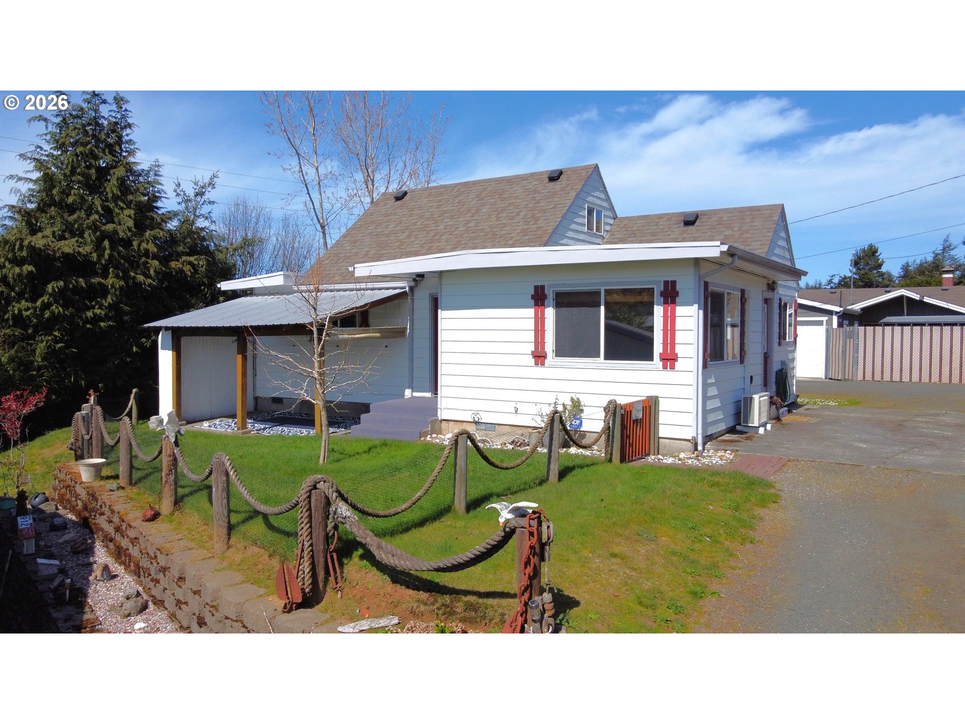 1092 Lewis Street North Bend, OR 97459 - Photo 31 of 43 a backyard of a house with outdoor seating