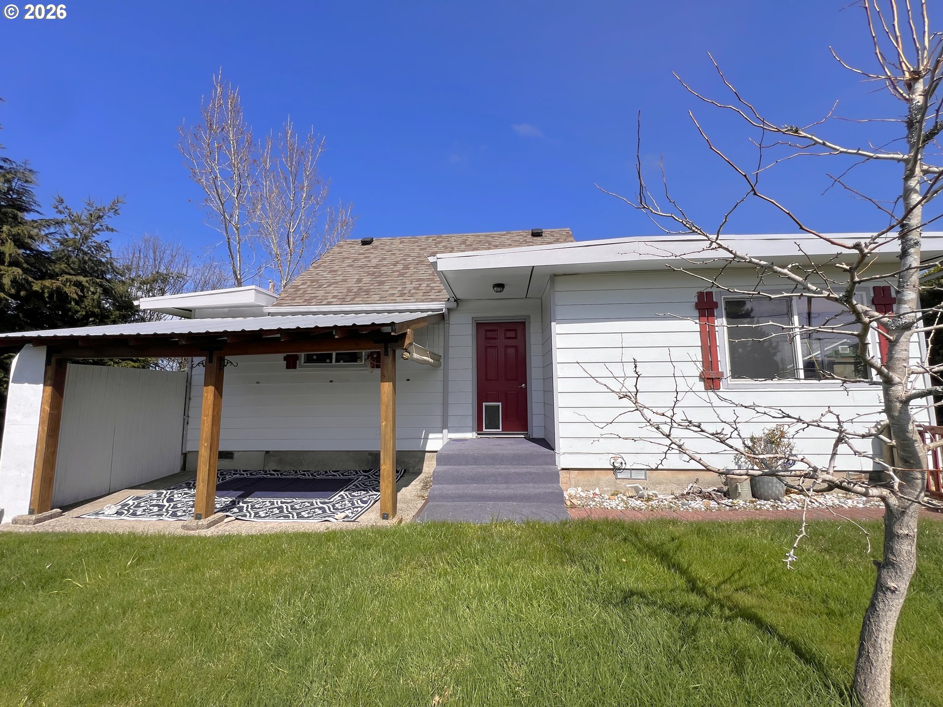1092 Lewis Street North Bend, OR 97459 - Photo 36 of 43 a front view of a house with a yard