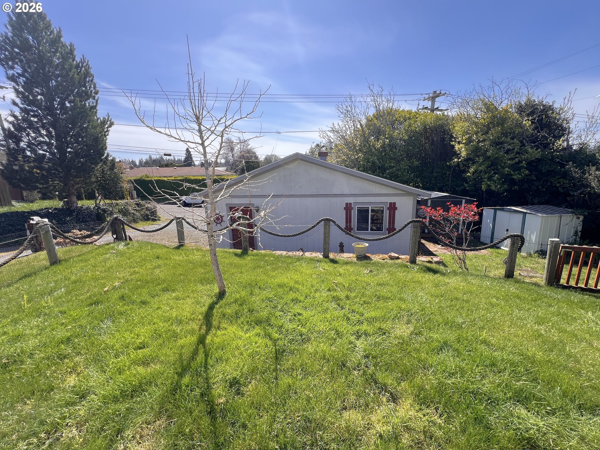 1092 Lewis Street North Bend, OR 97459 - Photo 37 of 43 a backyard of a house with table and chairs