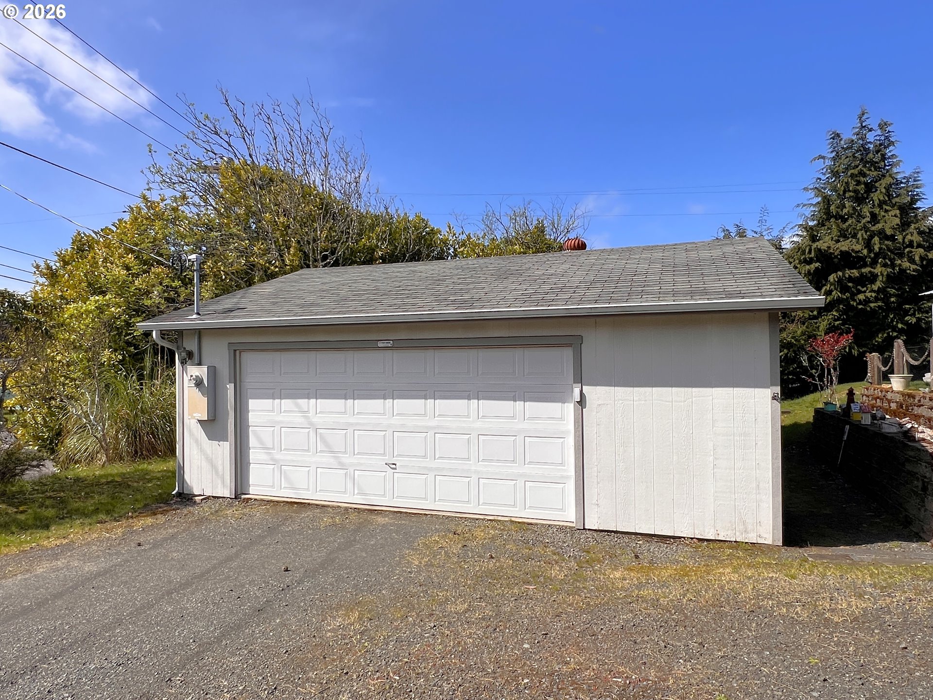 1092 Lewis Street North Bend, OR 97459 - Photo 5 of 43 a front view of a house with a garage