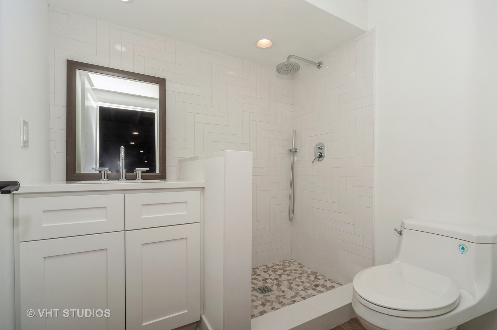 217 Devon Avenue Park Ridge, IL 60068 - Photo 22 of 28 a bathroom with a toilet a sink and shower