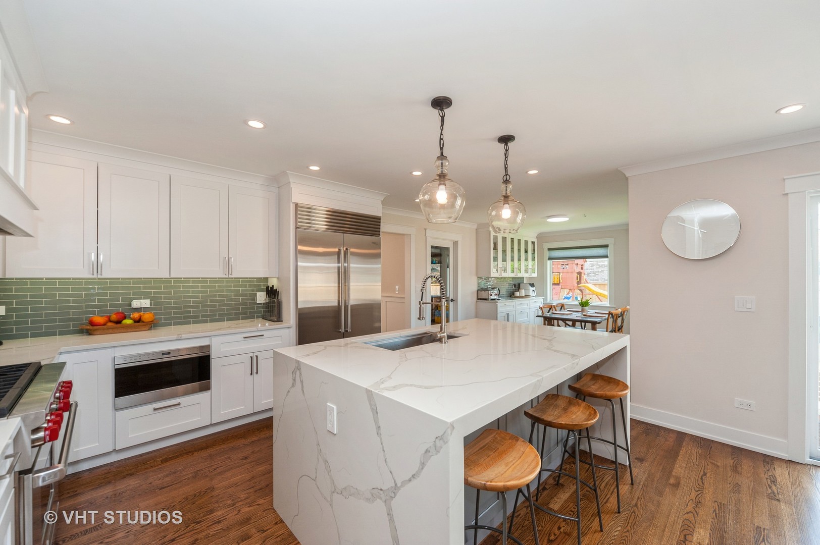 217 Devon Avenue Park Ridge, IL 60068 - Photo 6 of 28 a kitchen that has a table chairs and a refrigerator