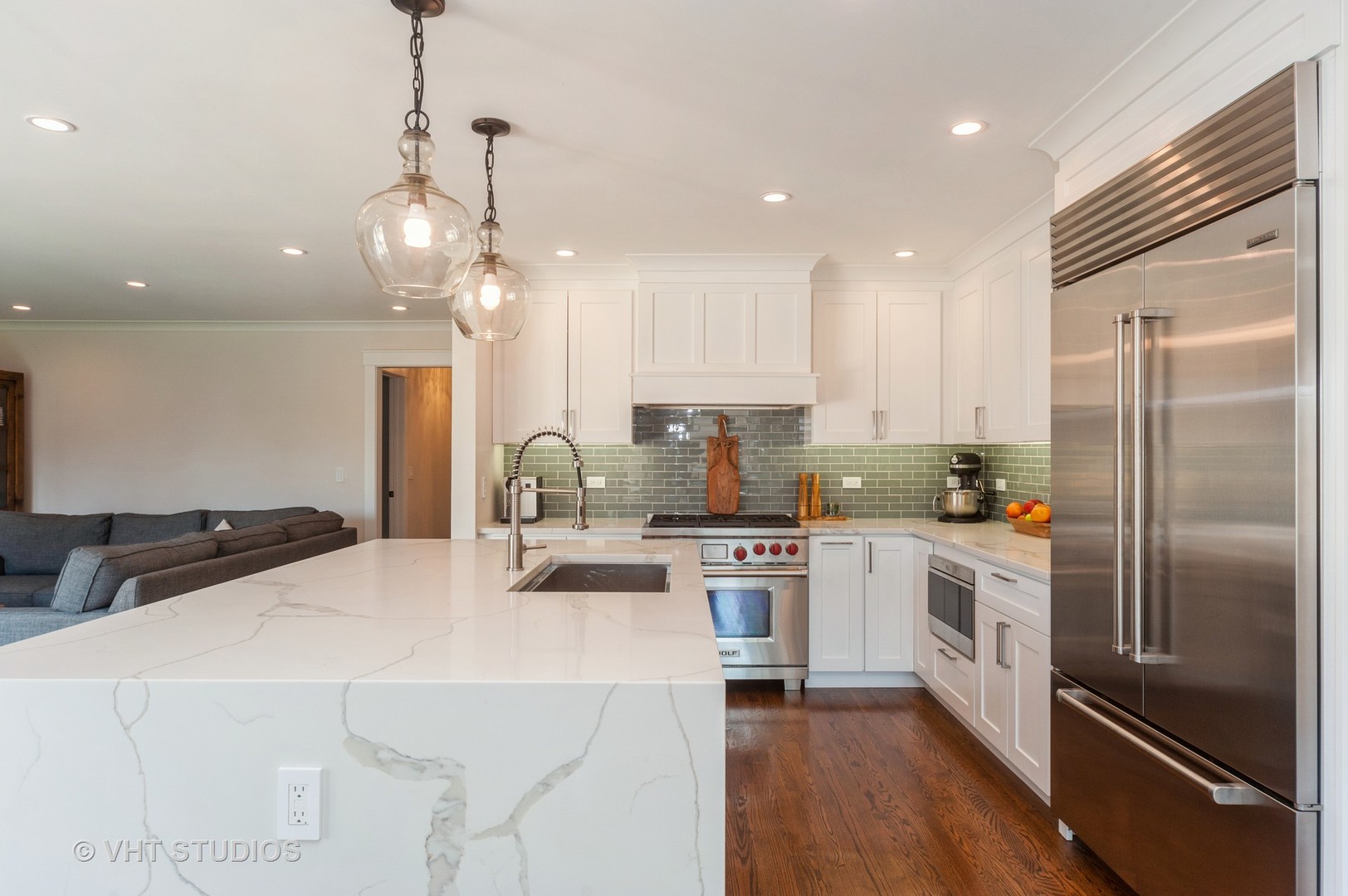 217 Devon Avenue Park Ridge, IL 60068 - Photo 7 of 28 a kitchen with stainless steel appliances kitchen island granite countertop a refrigerator a sink dishwasher a stove and white cabinets with wooden floor