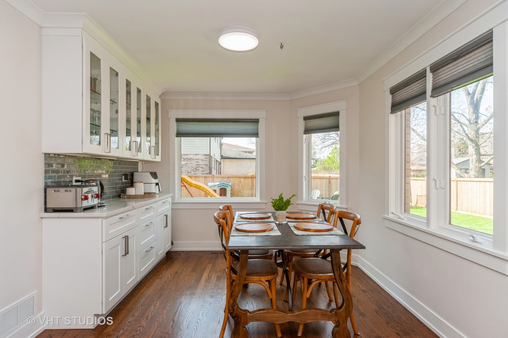 217 Devon Avenue Park Ridge, IL 60068 - Photo 8 of 28 a kitchen with a table chairs stove and cabinets