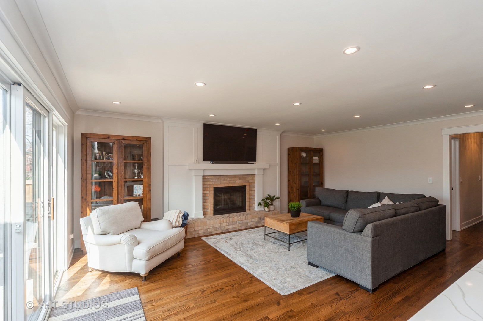 217 Devon Avenue Park Ridge, IL 60068 - Photo 9 of 28 a living room with furniture and a fireplace