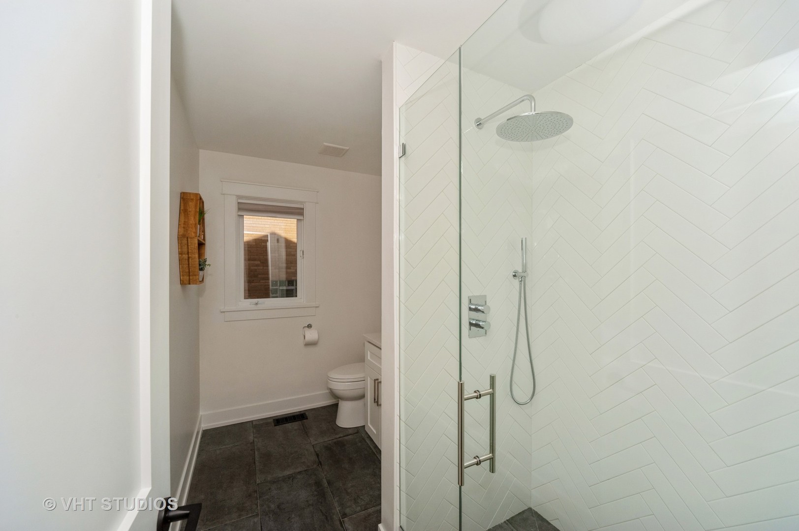 217 Devon Avenue Park Ridge, IL 60068 - Photo 10 of 28 a bathroom with a granite countertop shower and a toilet