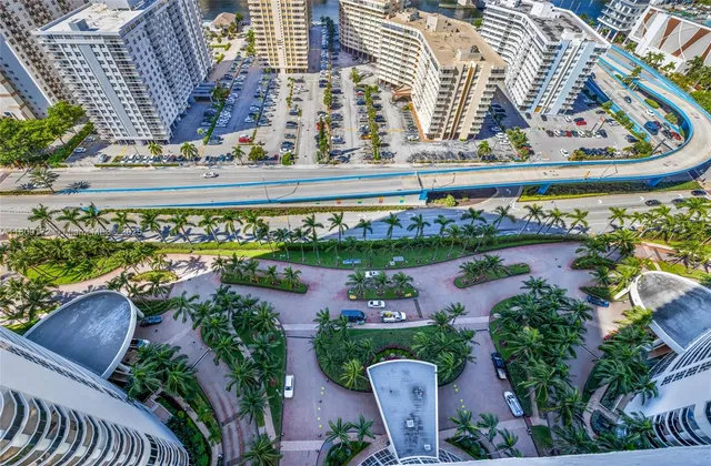 an aerial view of a house with outdoor space pool patio and lake view