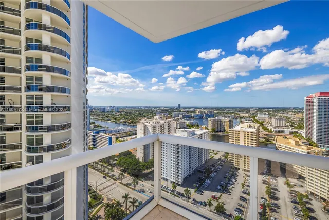 a view of a balcony with city view