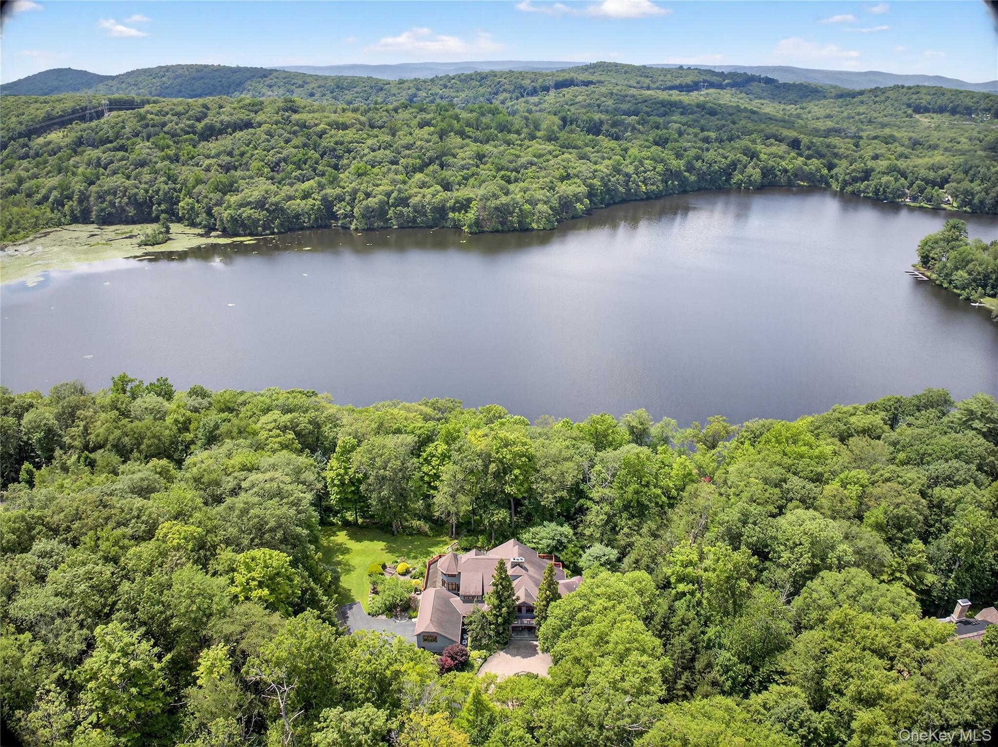 6 Old Cranberry Road Sloatsburg, NY 10974 - Photo 1 of 13 Drone / aerial view of a forest and a nearby body of water