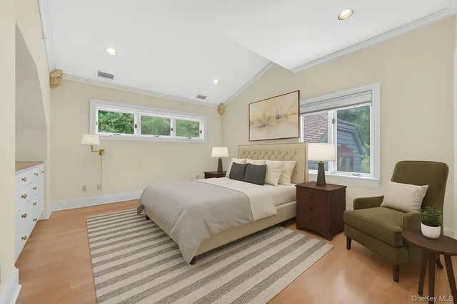 a bedroom with a bed and a couch