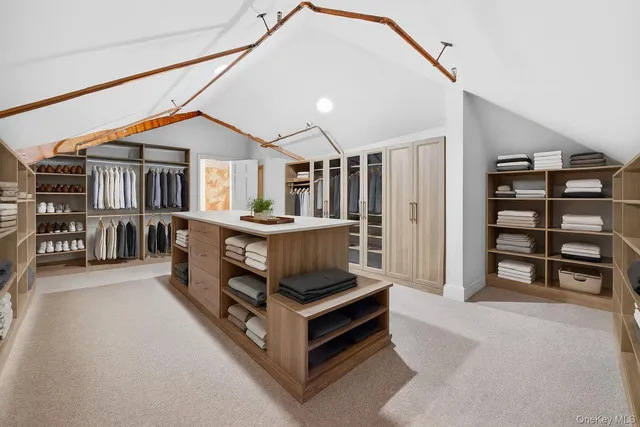 a bedroom with furniture and a book shelf