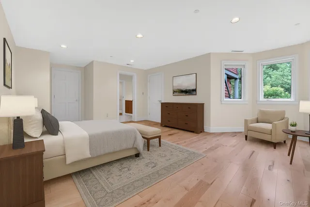 a bedroom with a bed and a couch