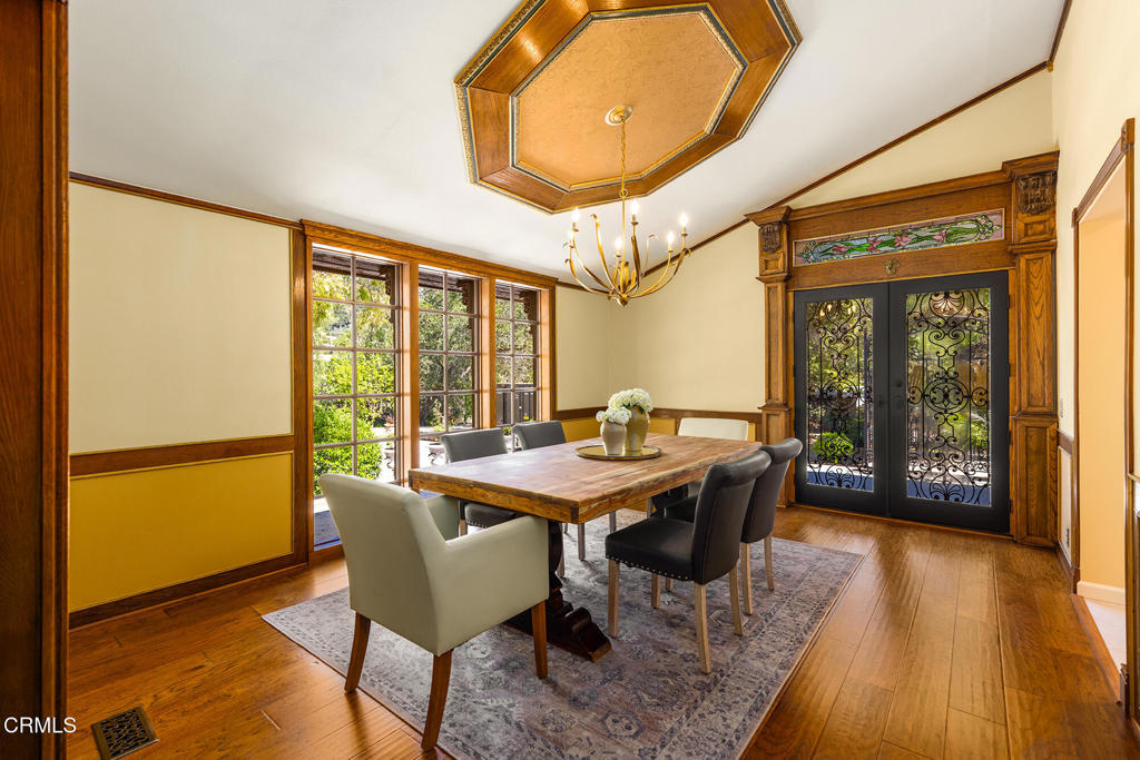 10484 Creek Road Oak View, CA 93022 - Photo 11 of 52 a dining room with furniture and wooden floor
