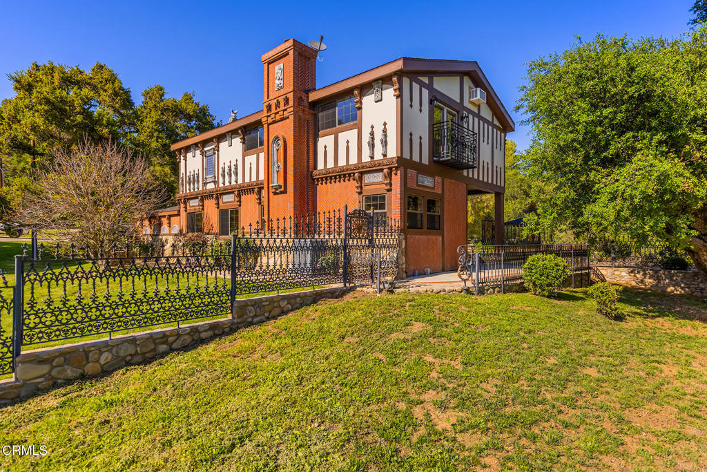 10484 Creek Road Oak View, CA 93022 - Photo 3 of 52 a view of a house with a iron fence