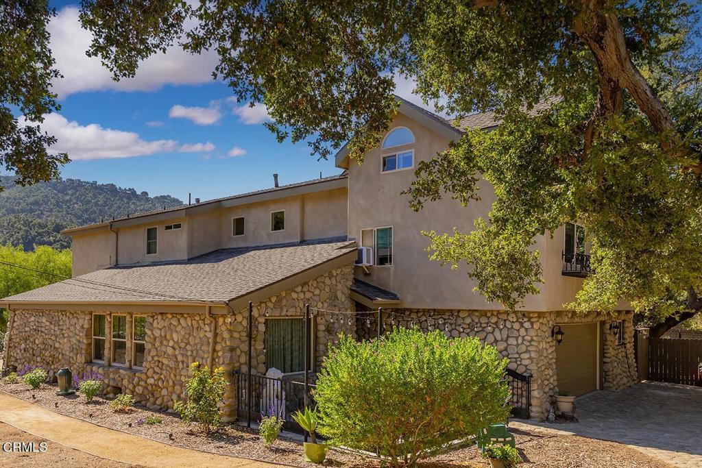10484 Creek Road Oak View, CA 93022 - Photo 4 of 52 a front view of a house with garden