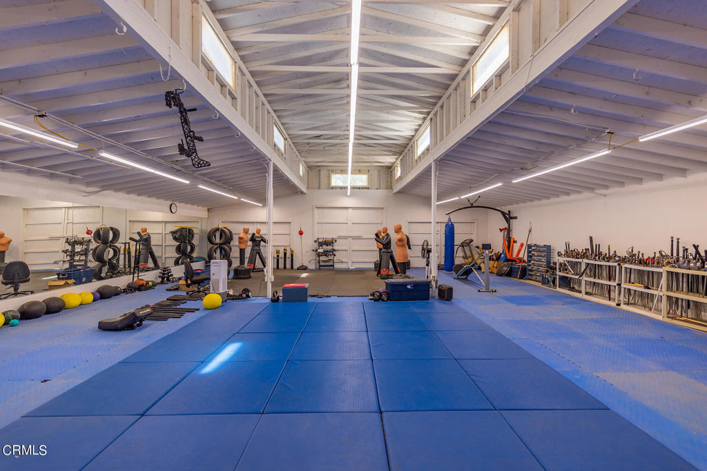 10484 Creek Road Oak View, CA 93022 - Photo 45 of 52 a view of a garage with gym equipment