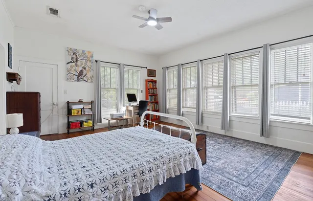 a bedroom with a large bed and a large dresser