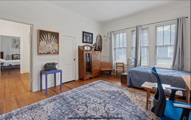 a view of a livingroom with furniture and window