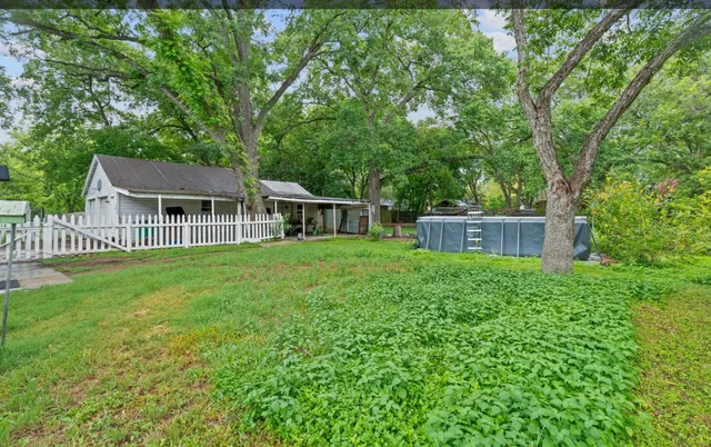 a backyard of a house with lots of green space
