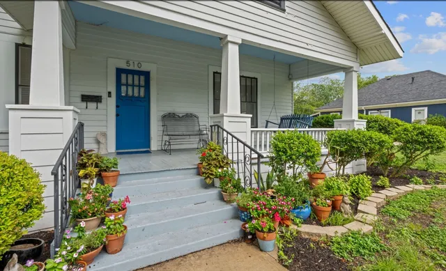 front view of a house with a yard