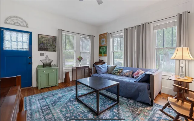 a living room with furniture and a window