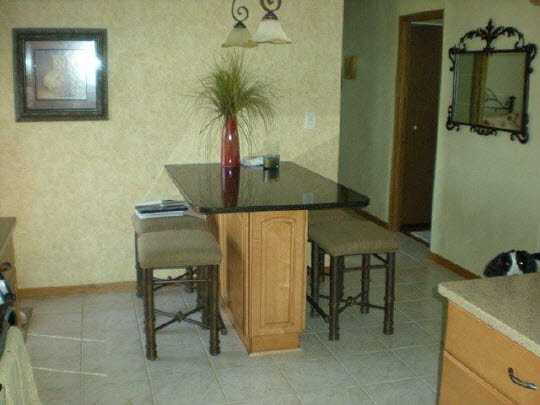 1711 East Currier Road Freeport, IL 61032 - Photo 6 of 8 a room with a table and a chair