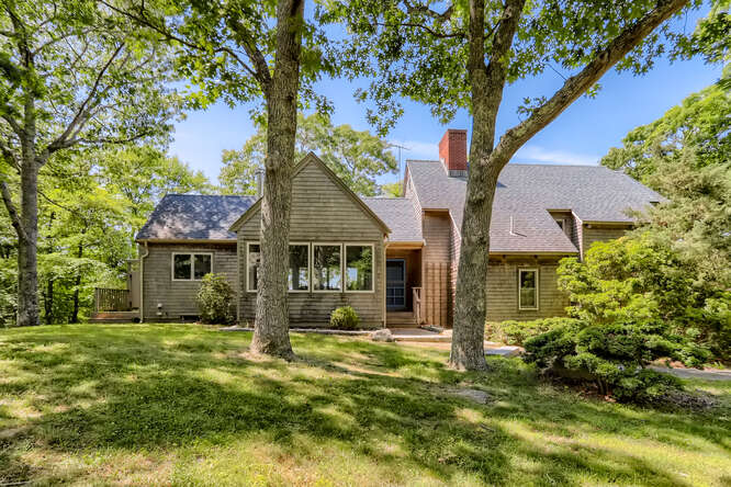 front view of a house with a yard
