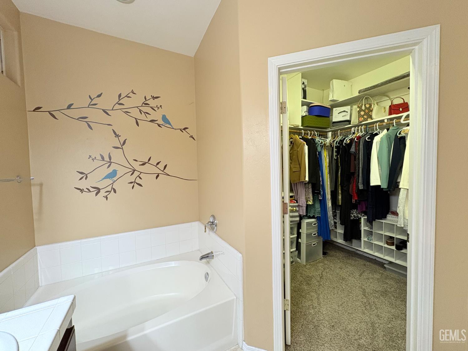 Undisclosed Address Bakersfield, CA 93311 - Photo 12 of 19 a bathroom with a bathtub and a shower