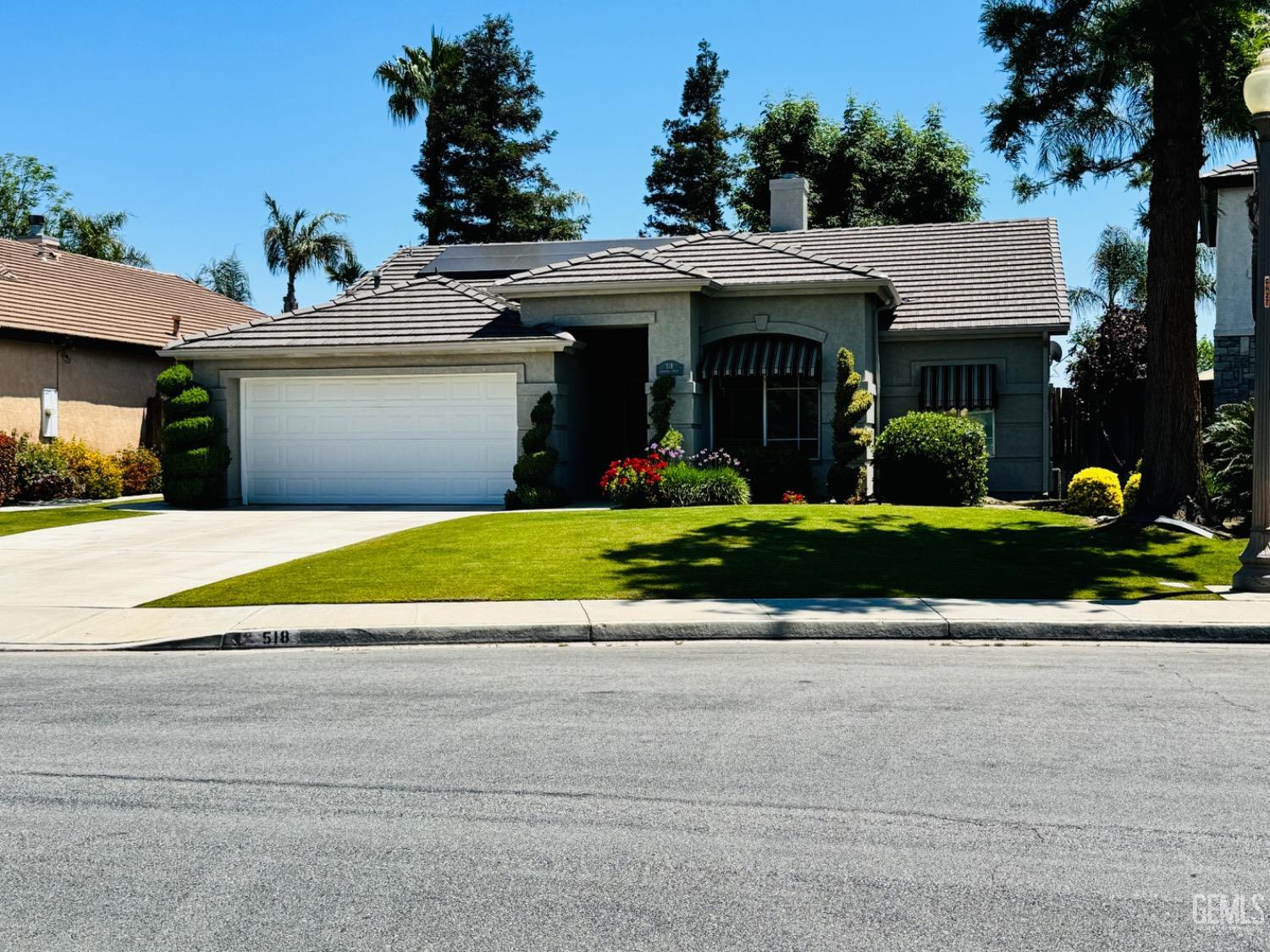 Undisclosed Address Bakersfield, CA 93311 - Photo 4 of 19 a view of a house with a yard and potted plants