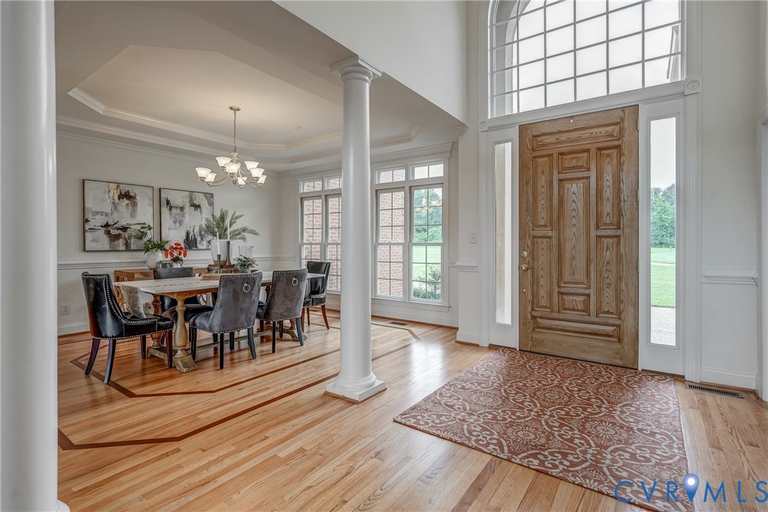 15154 Locust Level Drive Doswell, VA 23047 - Photo 15 of 48 a view of a dining room with furniture and chandelier