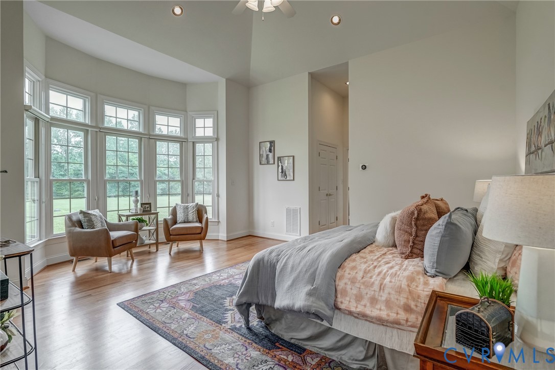 15154 Locust Level Drive Doswell, VA 23047 - Photo 20 of 48 a living room with furniture and a floor to ceiling window