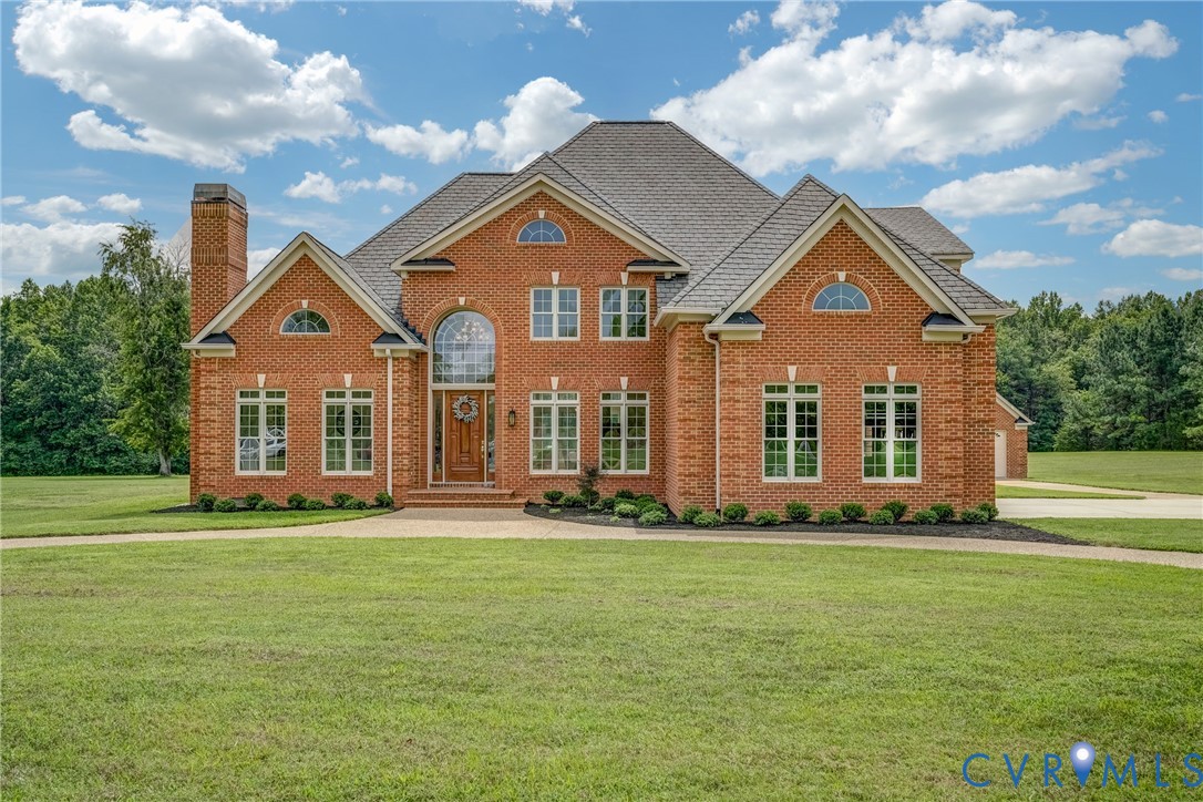15154 Locust Level Drive Doswell, VA 23047 - Photo 2 of 48 a front view of a house with a garden