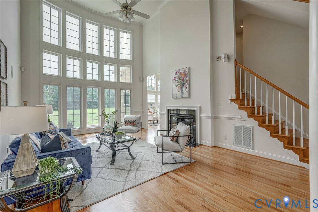 15154 Locust Level Drive Doswell, VA 23047 - Photo 27 of 48 a living room with fireplace furniture and a large window