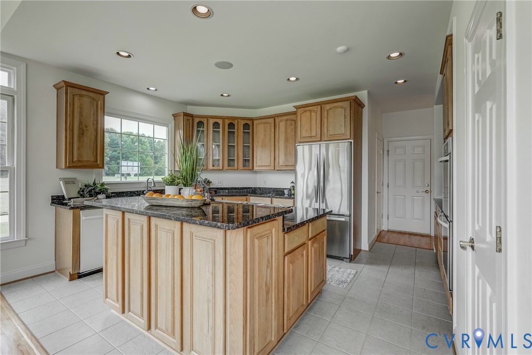 15154 Locust Level Drive Doswell, VA 23047 - Photo 37 of 48 a kitchen with stainless steel appliances a sink stove and refrigerator