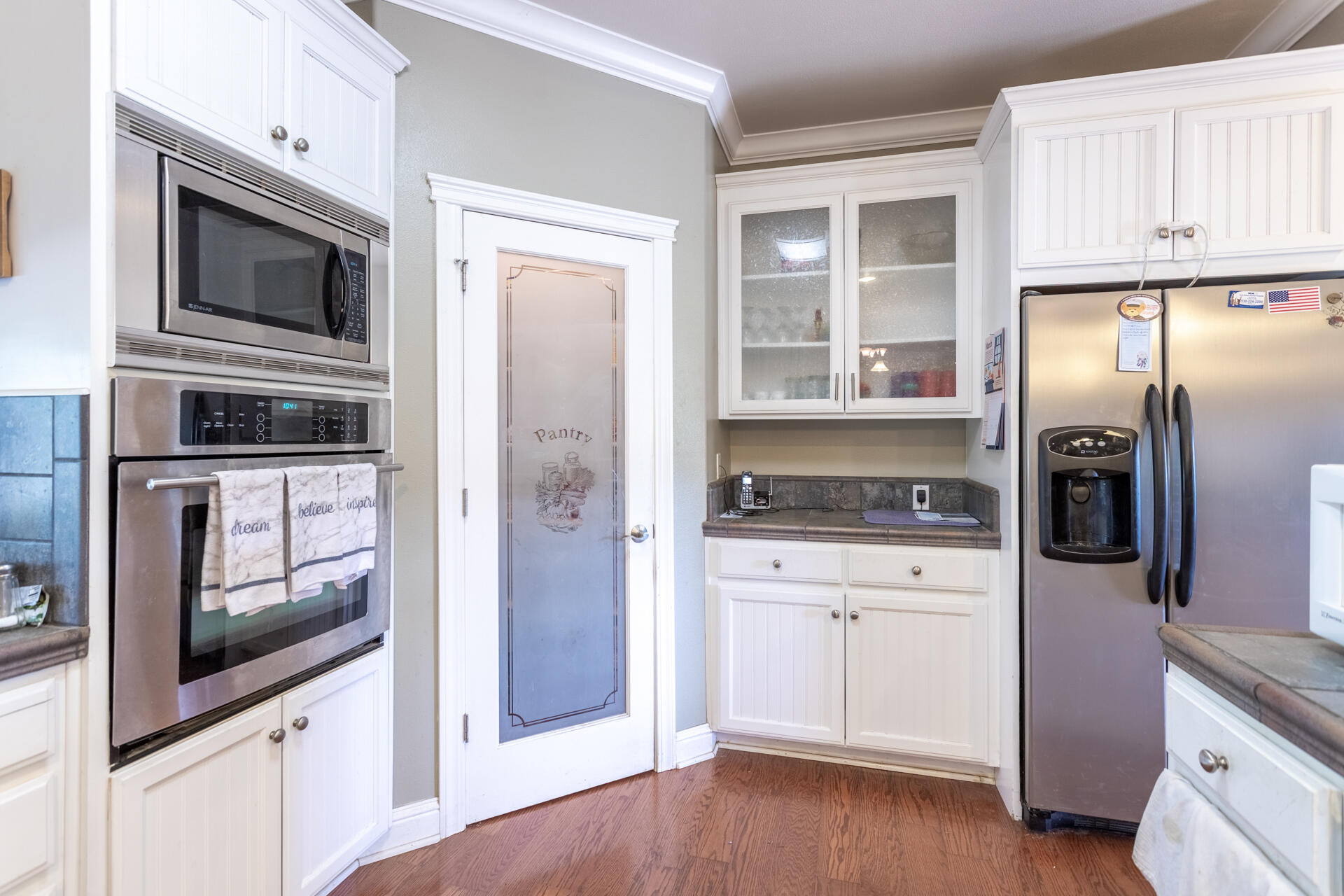 11847 Oak Run Road Oak Run, CA 96069 - Photo 15 of 54 a kitchen with cabinets stainless steel appliances and wooden floor