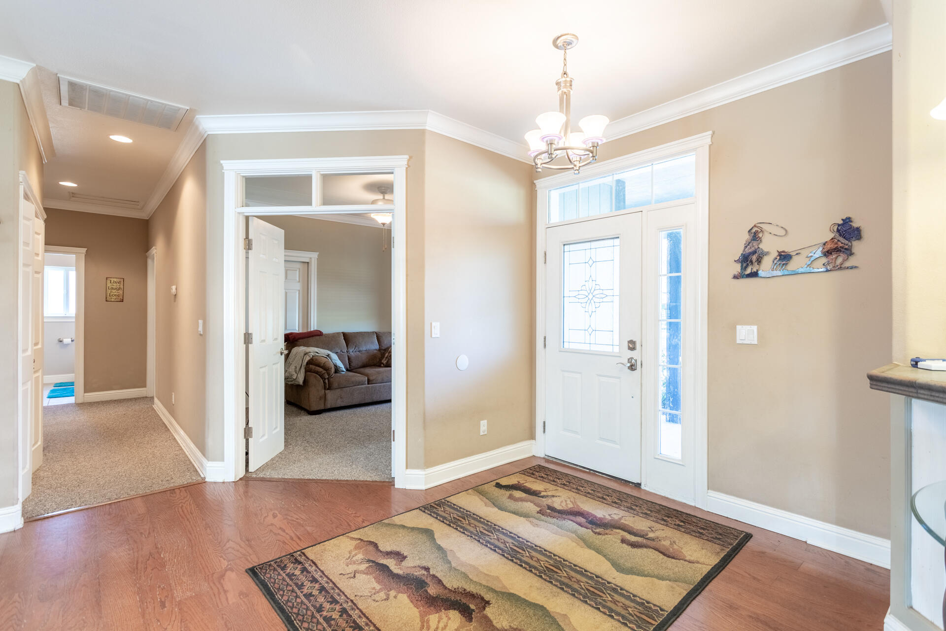 11847 Oak Run Road Oak Run, CA 96069 - Photo 16 of 54 a bedroom with a bed and a chandelier