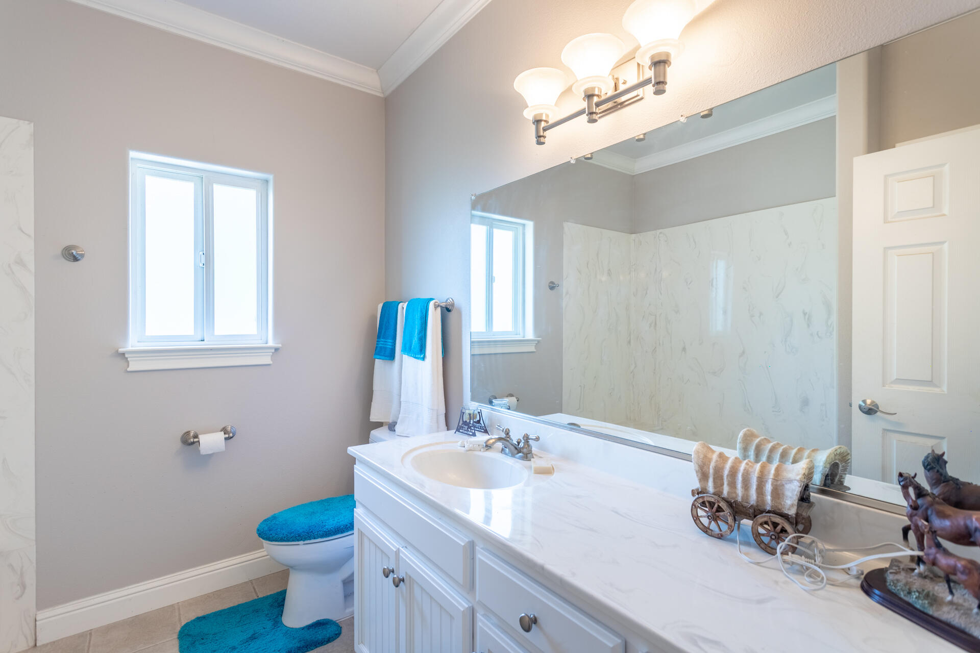 11847 Oak Run Road Oak Run, CA 96069 - Photo 23 of 54 a bathroom with a granite countertop sink a toilet and a mirror
