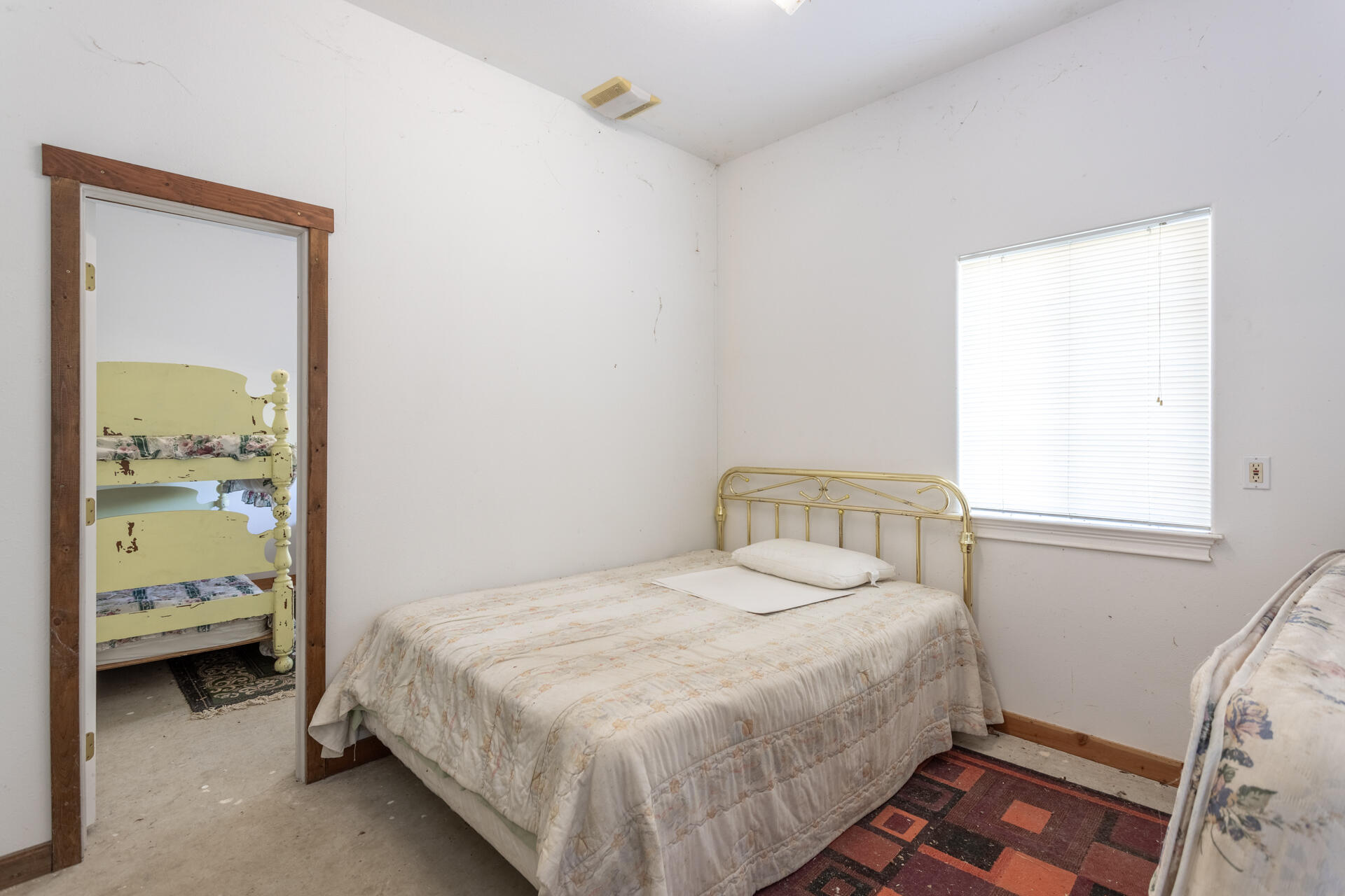 11847 Oak Run Road Oak Run, CA 96069 - Photo 30 of 54 a bedroom with a bed and a window