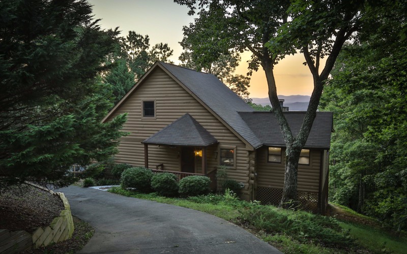 952 Camp Branch Road Ellijay, GA 30540 - Photo 1 of 1 a front view of a house with garden