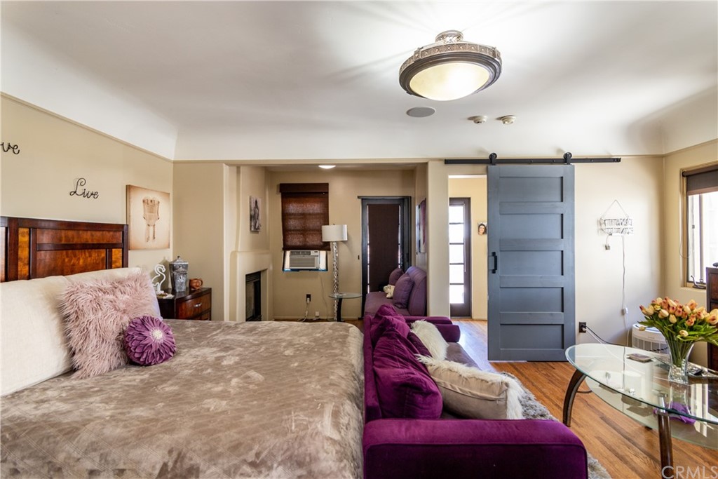 66 Corinthian Walk Long Beach, CA 90803 - Photo 15 of 26 a bedroom with a bed and furniture