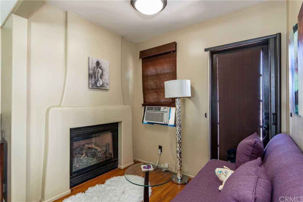 66 Corinthian Walk Long Beach, CA 90803 - Photo 17 of 26 a living room with furniture and a fireplace