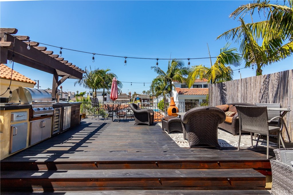 66 Corinthian Walk Long Beach, CA 90803 - Photo 24 of 26 a view of a patio with table and chairs potted plants