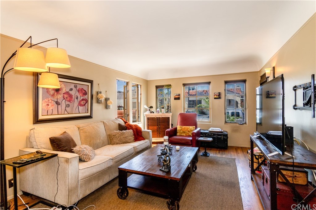 66 Corinthian Walk Long Beach, CA 90803 - Photo 3 of 26 a living room with furniture and a flat screen tv