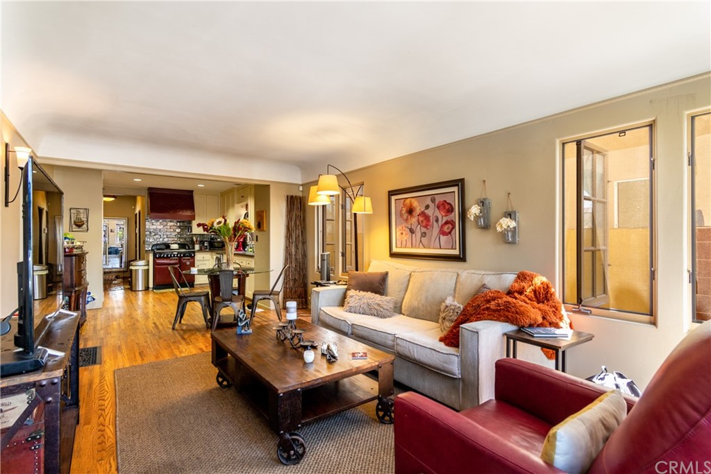 66 Corinthian Walk Long Beach, CA 90803 - Photo 5 of 26 a living room with furniture and a large window
