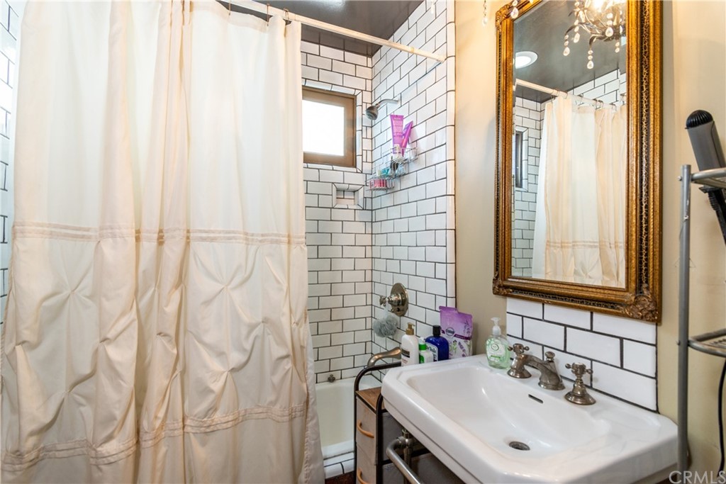 66 Corinthian Walk Long Beach, CA 90803 - Photo 8 of 26 a bathroom with a sink and a mirror