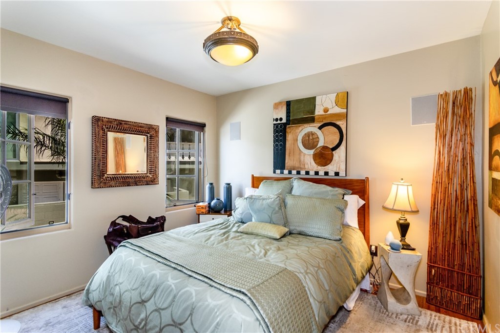 66 Corinthian Walk Long Beach, CA 90803 - Photo 9 of 26 a bedroom with bed and a window