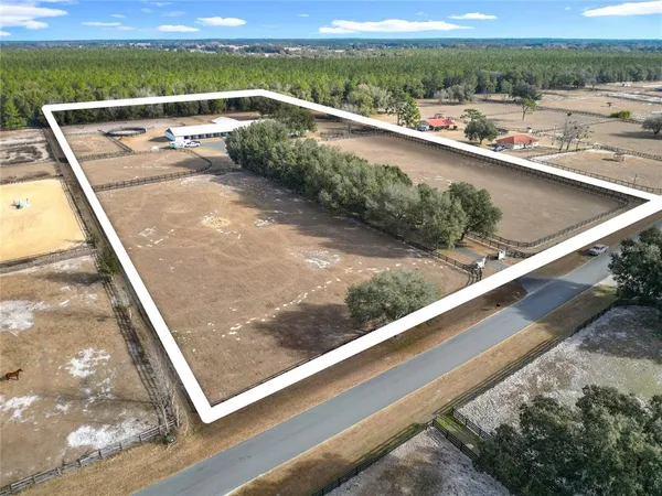 an aerial view of residential house with outdoor space
