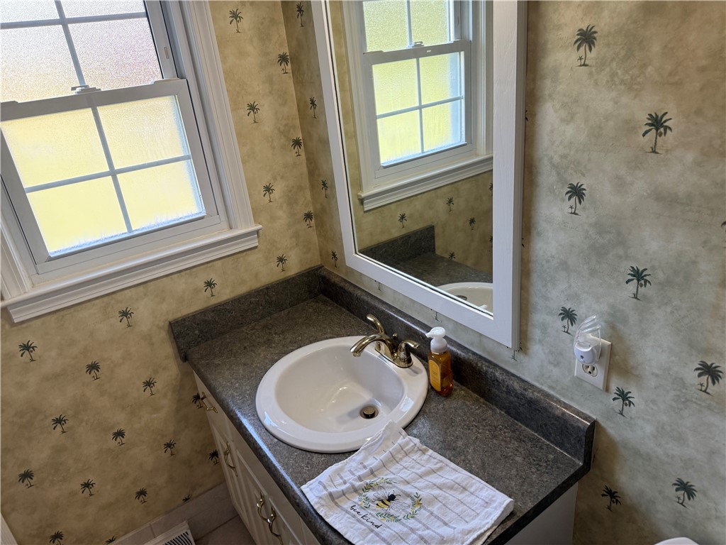 121 Nautical Way Anderson, SC 29625 - Photo 33 of 37 A well-lit vanity with ample counter space and a classic gold-toned faucet.